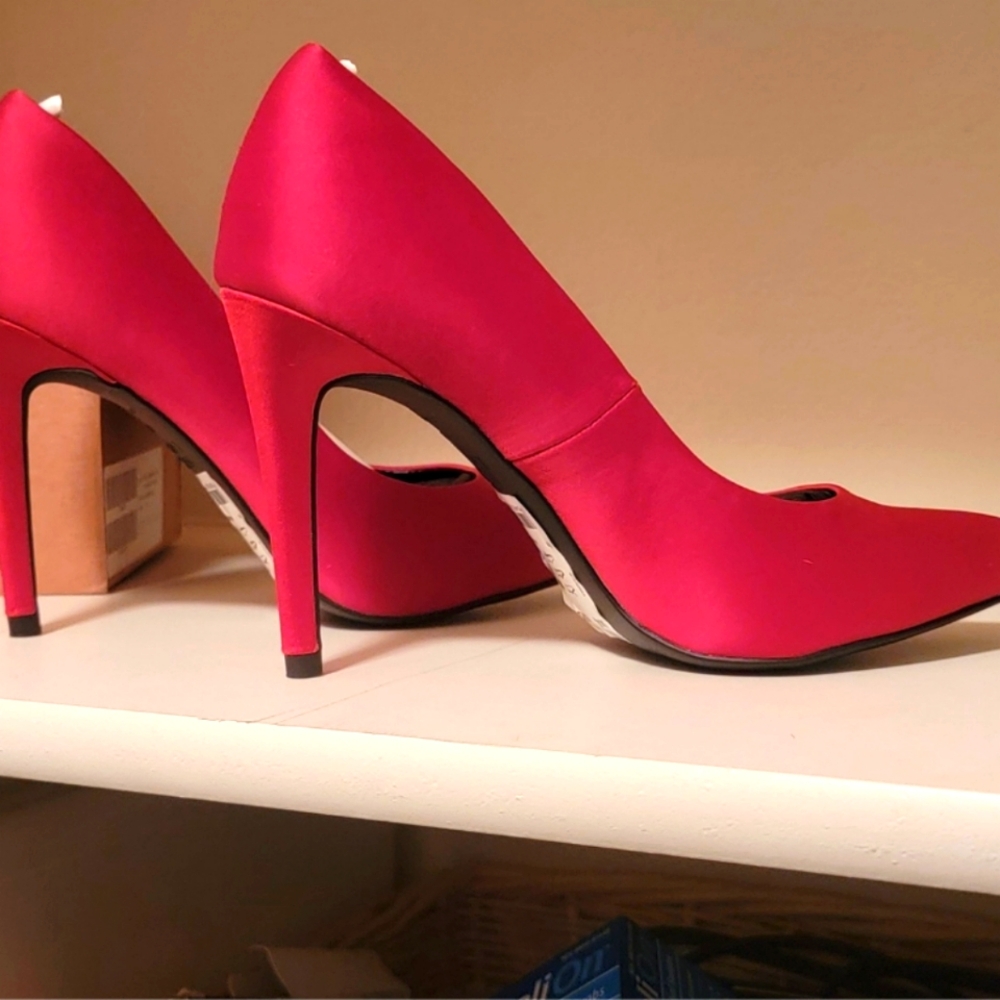 Never worn, Red/Orange Satin Heels that will turn heads!